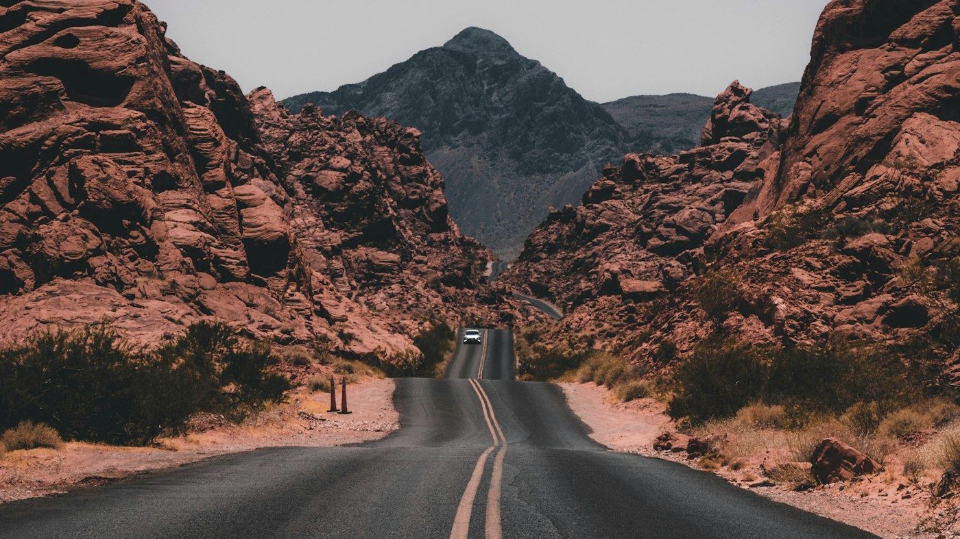 Empty road through muted red rock country