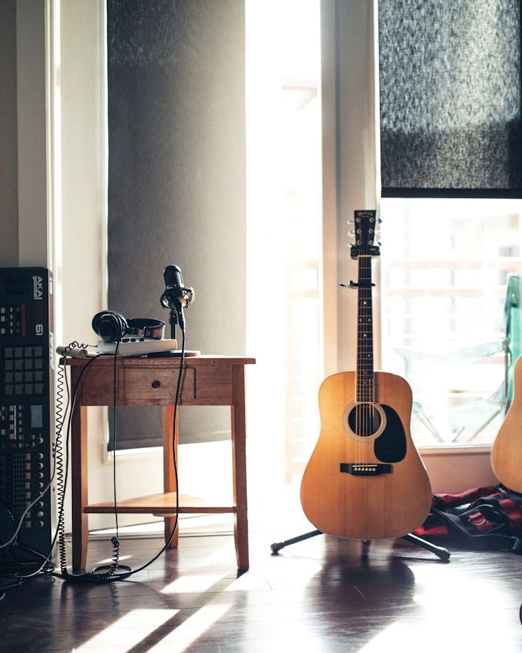 Guitars in a home studio lit by window light